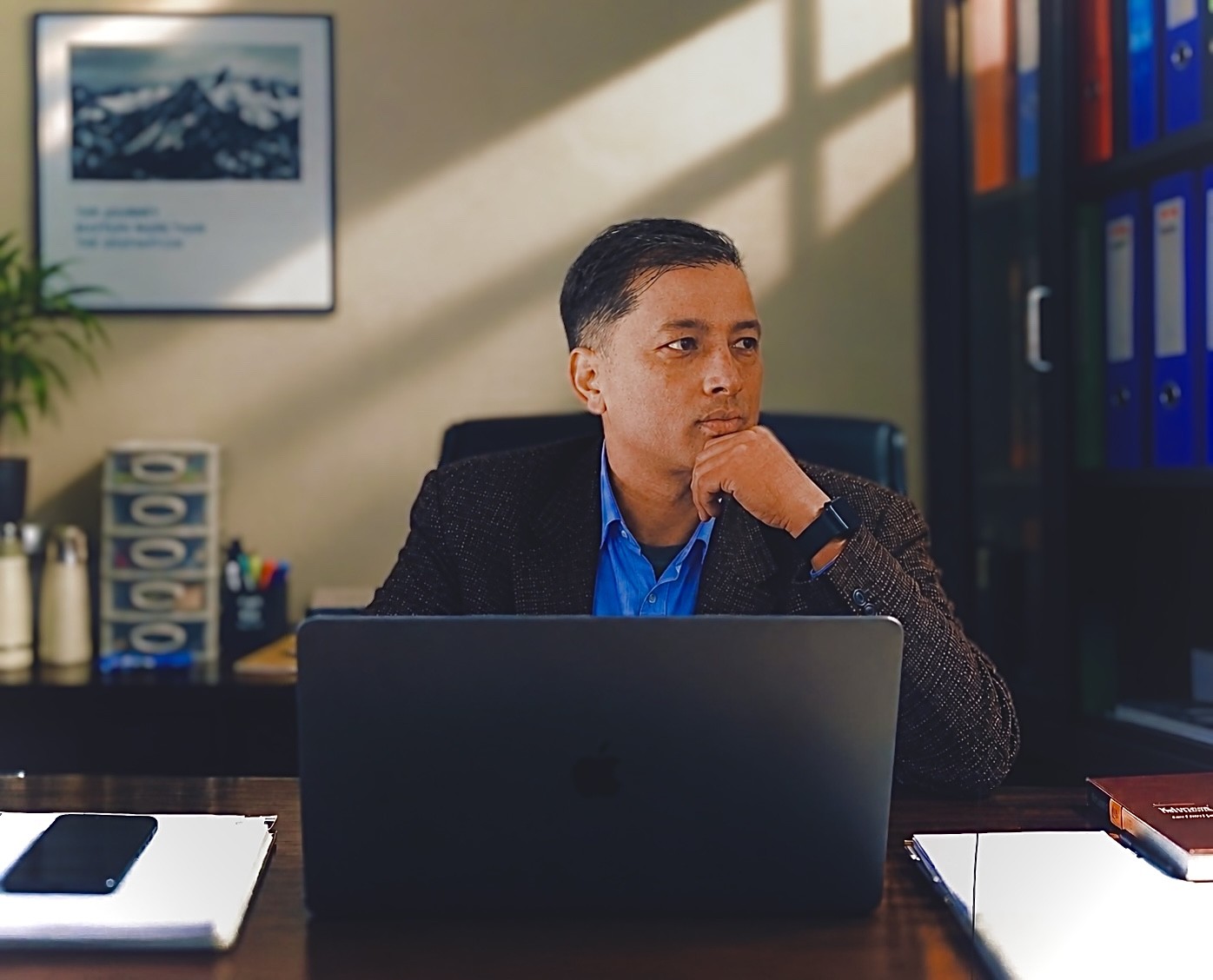 The CEO of Ganadeep Pashmina Industry at his desk
