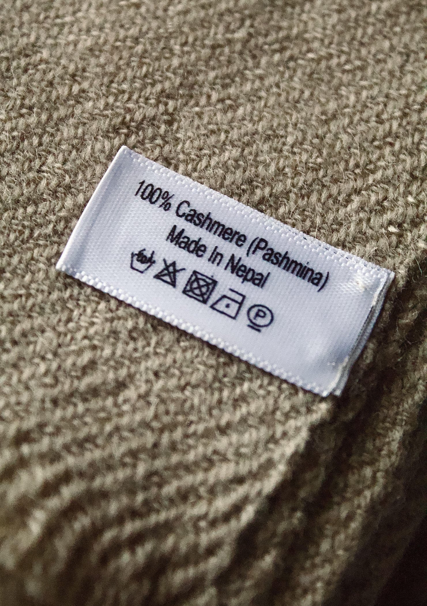 Label on a Ganadeep shawl reading 100% Cashmere (Pashmina), Made in Nepal